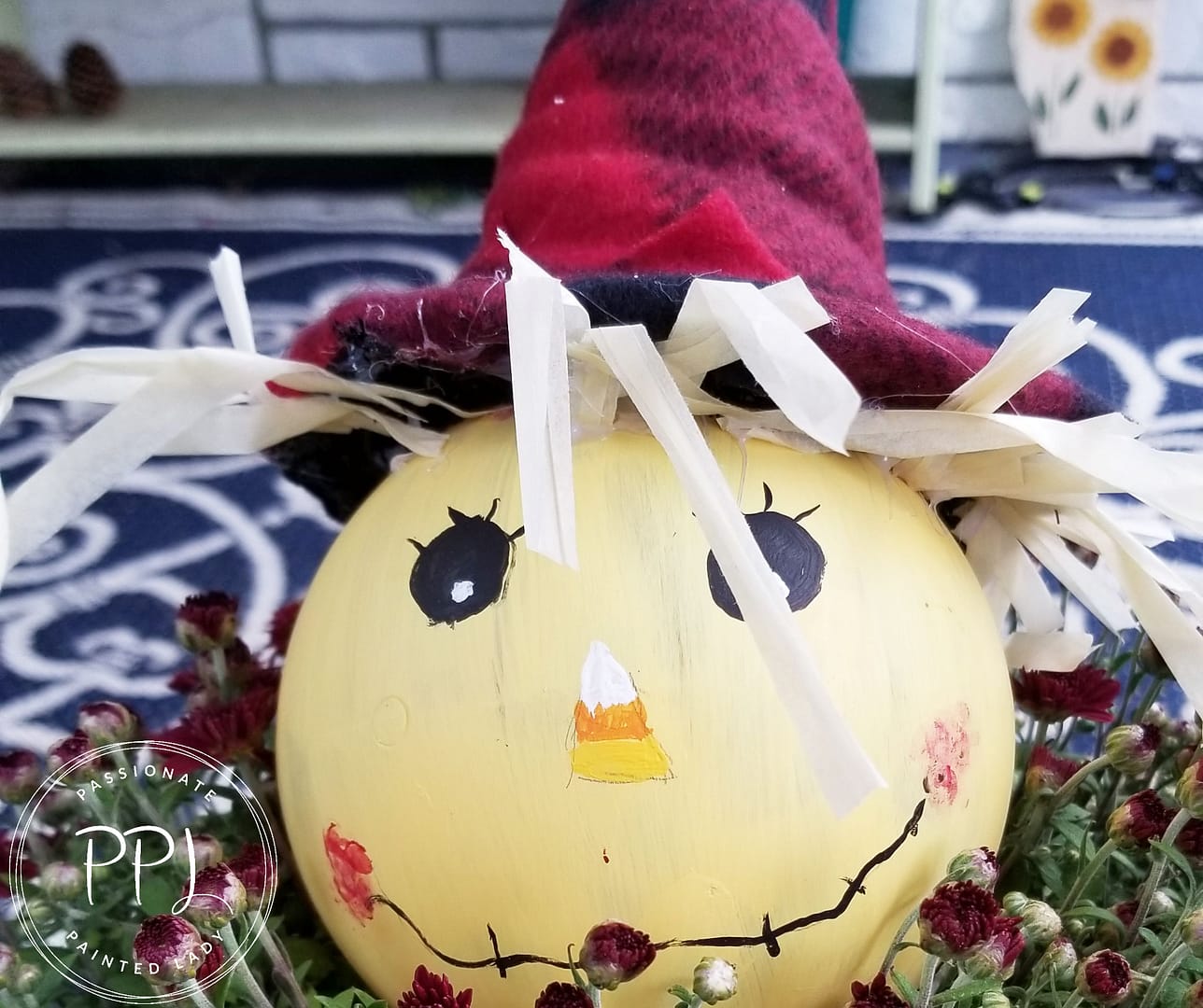 create a pumpkin and scarecrow tealight using simple objects