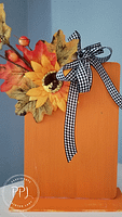 create a cute wooden pumpkin sitter using cutting boards and easy-to-find supplies